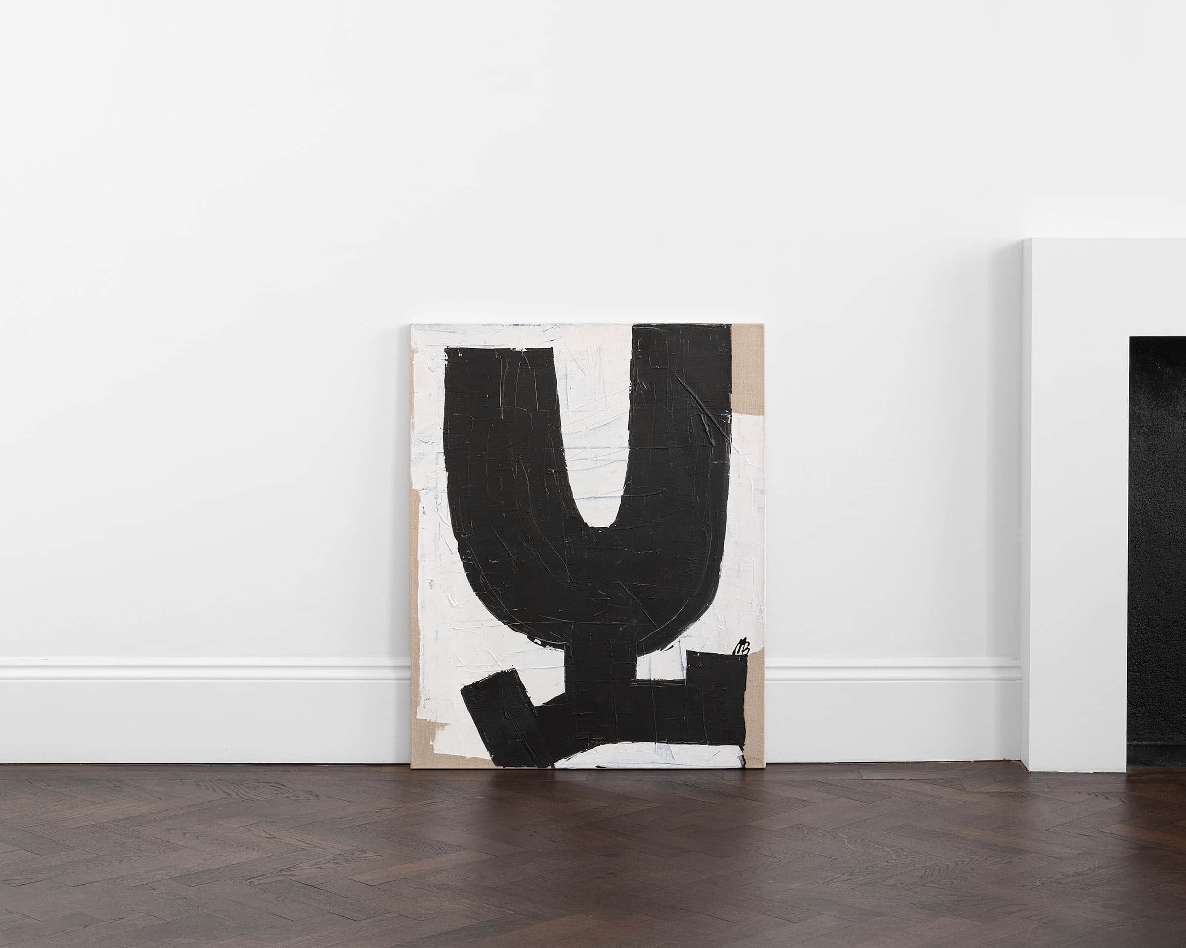 A black letter Y on a white and brown background.